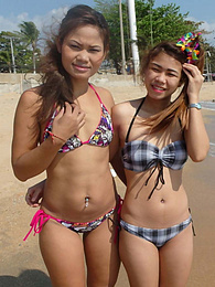 Thai lesbians in the throw of passion distracted by a white tourist's hard-on pictures
