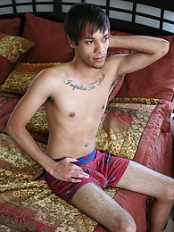 Remy Lebeau laying on his bed with a fully erect cock pictures at kilopills.com