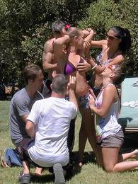 Three naughty girls gets banged outdoors in group sex game